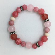 "💘 Rose Quartz, Pink Jade & Cherry Agate Gemstone Bracelet, Valentines Day Gift for Her, Boho Healing Bracelet. Colorful semi precious bracelet. Free Shipping.  Accents are Gunmetal Crystal Spacer beads, they sparkle like CRAZY! So easy to LOVE! Our Bracelets look amazing stacked and layered, wearing more than one is so much FUN! 8mm, 10mm and 12mm Polished Semi Precious Polished Rose Quartz, Pink Jade and Cherry Agate Gemstone Beads. This listing is for one (1) Bracelet and comes packaged in C Rose Quartz Natural Stones Round Bracelets, Adjustable Pink Opal Bracelet, Rose Quartz Natural Stones Bracelet, Pink Adjustable Jade Jewelry, Round Rose Quartz Natural Stone Bracelets, Pink Gemstone Bracelets For Gift, Pink Opal Bracelets As Gifts, Pink Jade Jewelry As A Gift, Pink Jade Jewelry Gift