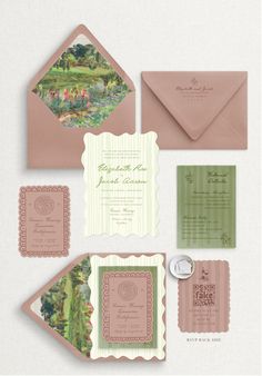 the wedding stationery is laid out on top of each other, including an envelope and matching cards