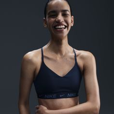 Don't let anything get in the way of expressing yourself in this sleek, low-profile sports bra. Its light support gives you a gentle hold with plenty of freedom that's great for low-impact workouts or all-day comfort. Smooth, quick-drying fabric gives the bra a clean finish so you can wear it your way. Nike Black Sports Bra, Nike Bras, Nike Sports Bras, Air Bra, Nike Clothes, Nike Bra, Expressing Yourself, All Black Shoes, Half Zip Jacket