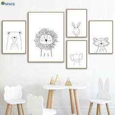 four children's art prints on the wall in a child's room with white chairs