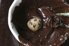 a chocolate dessert in a white bowl on a wooden table