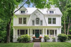 a large white house with lots of windows