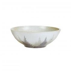 a white bowl with trees painted on the front and bottom, sitting on a white background