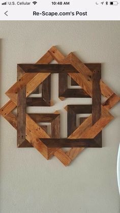 a wooden wall hanging on the side of a wall next to a plate and bowl