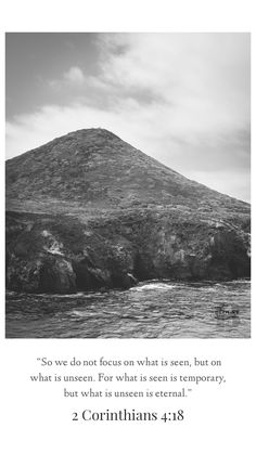 a black and white photo with a bible verse about the cross on top of a mountain