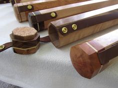 several pieces of wood sitting on top of a white cloth covered floor next to each other