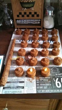 there are many donuts on the table ready to be eaten and served for sale