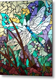 a stained glass window with dragonflies and flowers