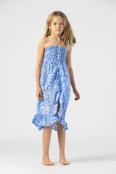 One of our most popular silhouettes needed a matching Mini version with a touch of playful energy. The Kids Eri Dress can be worn for any season, occasion, or playtime moment, creating the perfect match for family gatherings, vacations, or those fleeting moments of fun that define family. Details: 100% Rayon Hand Wash & Lay flat to dry Features: Unlined, Elastic smocked bodice, Caged back, Self tying tassel ties that can be worn strapless or as a halter neck, Ruffled hemline and cross fabric ove Define Family, Sandy Hair, Cross Fabric, Coral Ombre, Jasmine Dress, Cute Shoes Heels, Bohemian Clothing, Dress Stand, Popular Dresses