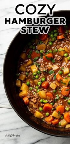 a close up of a bowl of stew with peas and carrots on the side