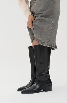 A slanting topline gives subtle-yet-surprising style to this knee-high boot that's fronted by a clipped pointed toe. 1 1/2" heel 15" shaft Pull-on style Leather upper and lining/synthetic sole Imported Modern Knee-high Boots For Business In Fall, Fall Business Knee-high Boots Modern Style, Knee-high Boots With High Shaft For Work, Classic Wide Calf Platform Boots For Workwear, Sleek Wide Calf Platform Boots For Work, Knee-length Boots For Spring Workwear, Spring Knee-length Boots For Work, Classic Knee-high Boots For Work, Sleek Tall Boots For Workwear