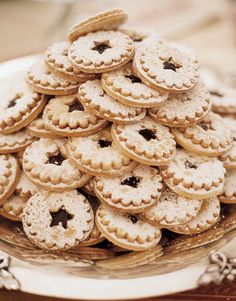 a platter filled with cookies on top of a wooden table