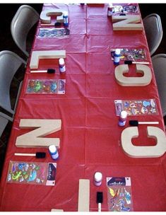 the table is covered with red cloth and letters that spell out jnj on it