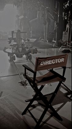 a director's chair sits in the middle of a stage