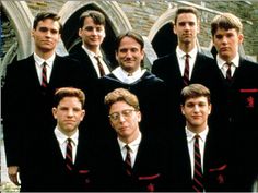 a group of young men wearing suits and ties