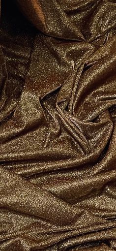 the fabric is shiny and shiny gold