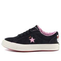 Hello Kitty fans rejoice! The iconic character has teamed up with sneaker giant Converse on the One Star Suede Low Top. The shoe is crafted from premium suede and features a pink star logo with Hello Kitty's bow just above it. Hello Kitty herself makes an appearance on the heel, adding a fun and playful touch. The sneaker comes equipped with Hello Kitty branded laces and a polka dot motif on the sockliner, making it the perfect choice for any Hello Kitty fan. Converse 1 Star, Sanrio Products, Black Skate Shoes, Pretty Sneakers, Hello Kitty Bow, Outfit References, Rockstar Gf, Shoe Ideas, Converse One Star