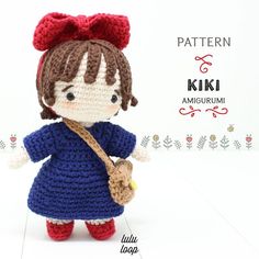 a crocheted doll with a red bow holding a teddy bear in her hand