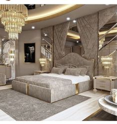 a large bed sitting in the middle of a bedroom next to a chandelier