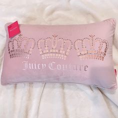 a pink pillow with a crown on it