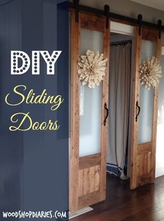 two wooden doors with wreaths on them and the words diy sliding doors