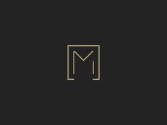 the letter m in gold on a black background