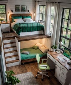 a bedroom with a bed, desk and stairs leading up to the loft above it