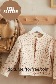 a coat and purse are hanging on a rack next to a wall with a sign that says free pattern