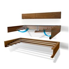 the bed frame is made out of wood and has two rails on each side with blue circles