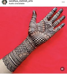 the hand is decorated with intricate designs on it