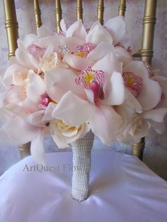 a bouquet of flowers sitting on top of a chair