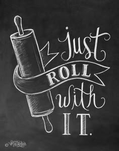 a chalkboard drawing with the words just roll with it