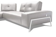 a white leather couch with metal legs and armrests on an isolated white background