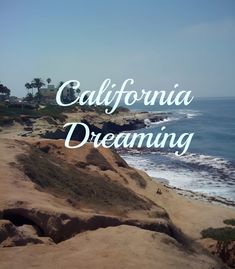 the words california dreaming are overlaided by an image of the beach and ocean