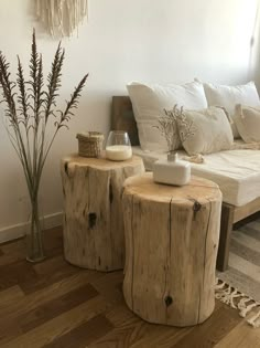 two wooden stools sitting next to each other on top of a hard wood floor