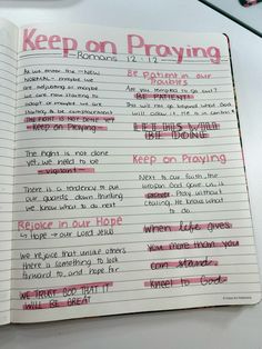 an open notebook with writing on it that says keep on praying and other words written in pink ink