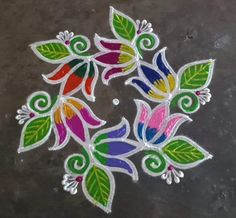 some colorful flowers and leaves painted on the ground with white thread in it's center