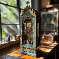 an ornate clock sitting on top of a wooden table