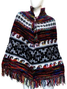 Great coverage, these ponchos really do keep you warm yet unrestricted. As warm as, and more comfortable than a sweater. Incredibly comfortable. Very easy off and on. Handmade poncho, with a very elegant style, very comfortable and warm, perfect for winter time.-With llamas design on the bottom. -Unique and stylish. -Goes with just about everything. -Get complimented every time you wear it.Material: Alpaca Wool. Alpaca Wool is hypoallergenic, light and warm. Its fibers contain microscopic air ba Handmade Alpaca Poncho For Winter, Handmade Alpaca Poncho Shawl, Handmade Alpaca Shawl Poncho, One Size Bohemian Alpaca Poncho, Bohemian Alpaca Cape For Winter, Fall Festival Alpaca Poncho, Bohemian Alpaca Shawl Cape, Bohemian Alpaca Cape For Fall, Cozy Alpaca Poncho Cape