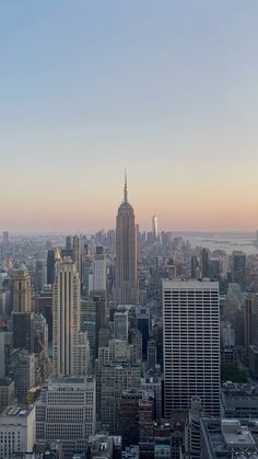 an aerial view of the city with tall buildings and skyscrapers in the foreground