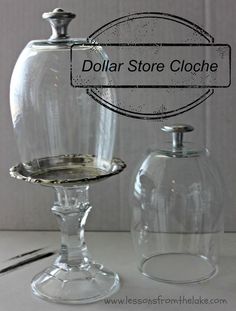 two clear glass vases sitting next to each other