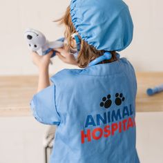 The care of all the toy "pets" in the house will be in capable hands when your little animal doctor is suited up in a machine-washable blue jacket, mask and surgical cap. The set includes a stethoscope with sound effects, syringe, thermometer, mask, cap, bandage, reusable veterinarian name tag and a little plush puppy patient to "doctor" and love. Toddler's Veterinarian Role Play Costume Set Toy - Melissa & Doug Veterinarian Costume, Vet Costume, Diy Doctor, Animal Doctor, Doctor Costume, Career Day, Melissa & Doug