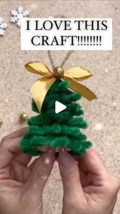 someone is making a christmas tree out of yarn and paper mache with the words i love this craft on it