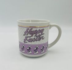 a coffee mug with the words happy easter written on it's front and side