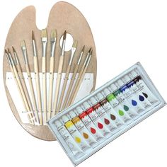 an assortment of paint brushes in a wooden holder with watercolor pencils and markers