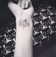 a woman's arm with a black and white photo of an owl tattoo on it