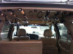 the inside of a vehicle with various items hanging from the ceiling