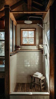 a small bathroom with a wooden bench in it