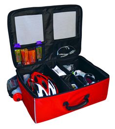 an open red suitcase filled with items on top of a white background and black handles