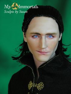 a close up of a doll wearing a black outfit